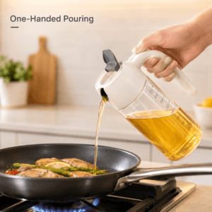 Oil bottle dispensing a measured pour into a pan