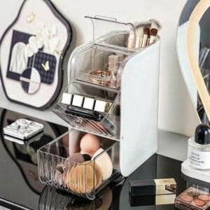 makeup organizer storing brushes, palettes and beauty sponges on a vanity