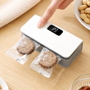 Rechargeable mini bag sealer closing individual snack packets